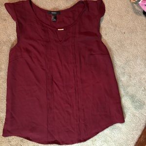 Sleeveless burgundy blouse